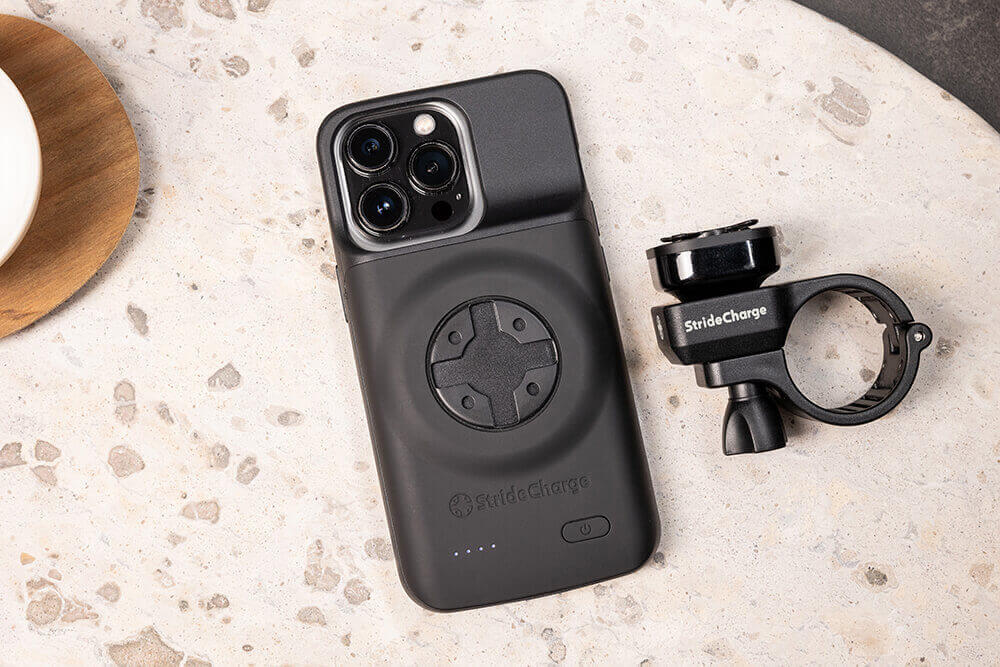 The StrideCharge Charge Case and Handlebar Mount on a table