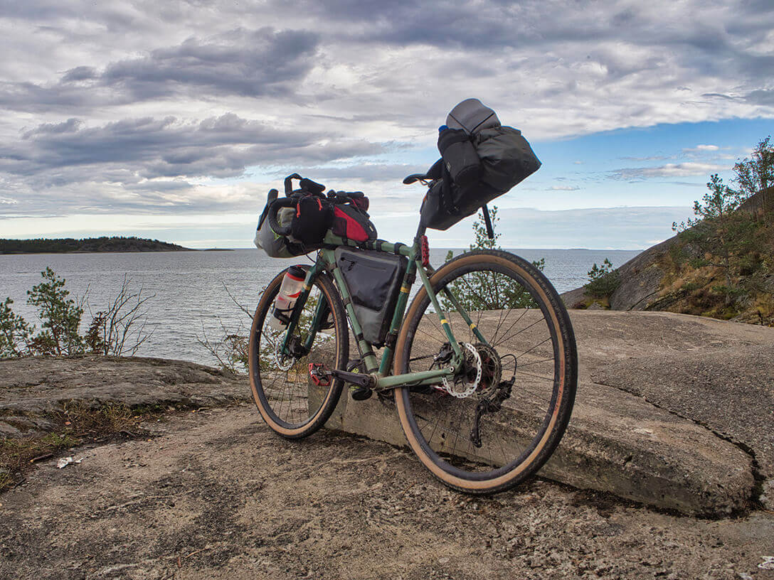 A bike set up for bike touring over looking the ocean