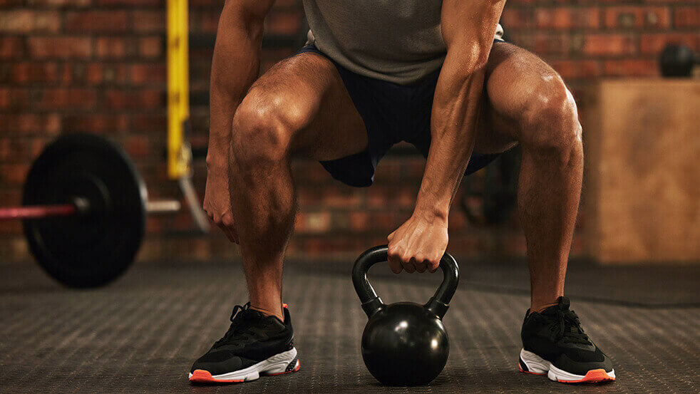 A person lifting a kettlebell