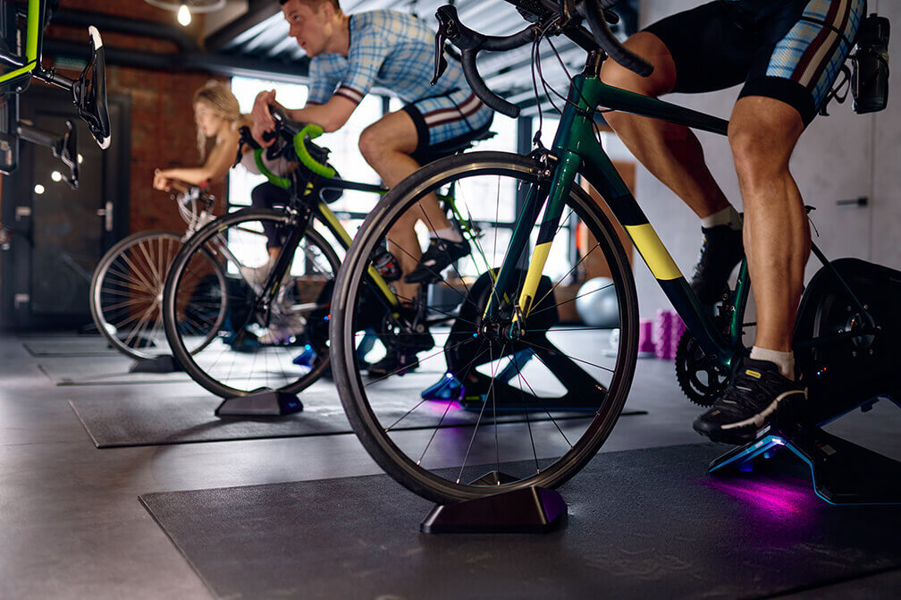 A number of cyclists using their indoor trainer