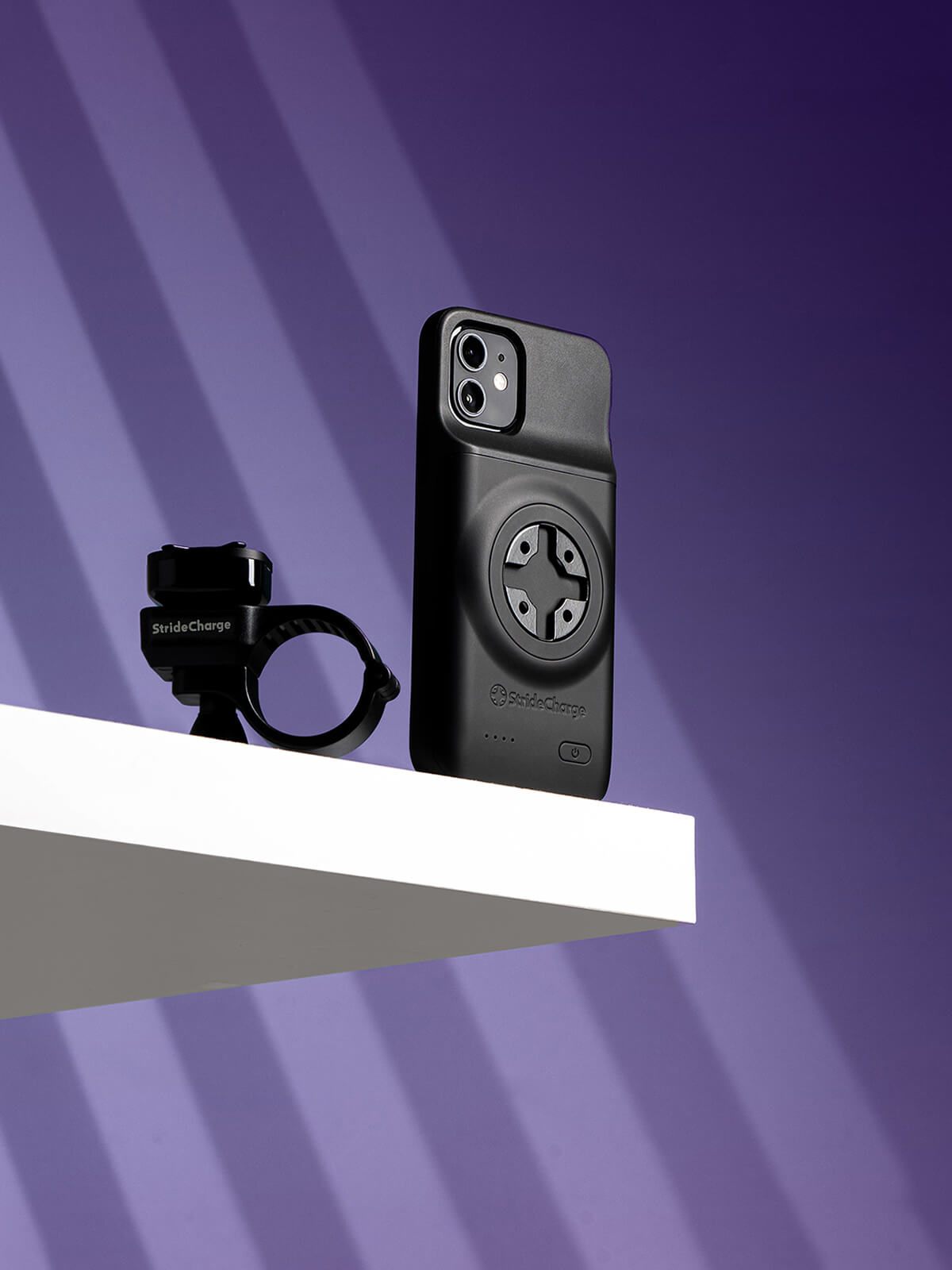 StrideCharge Case and Mount displayed on white ledge with purple background